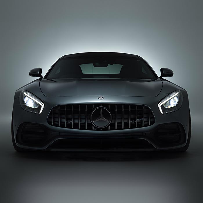 Front view of Mercedes sports car with headlights on
